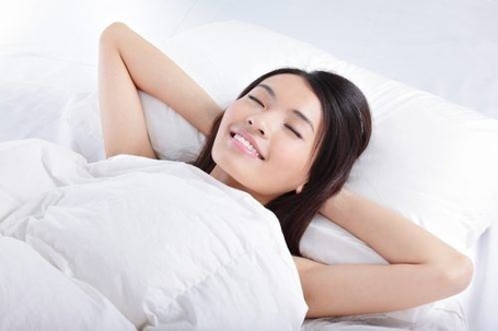 Relaxed woman in bed